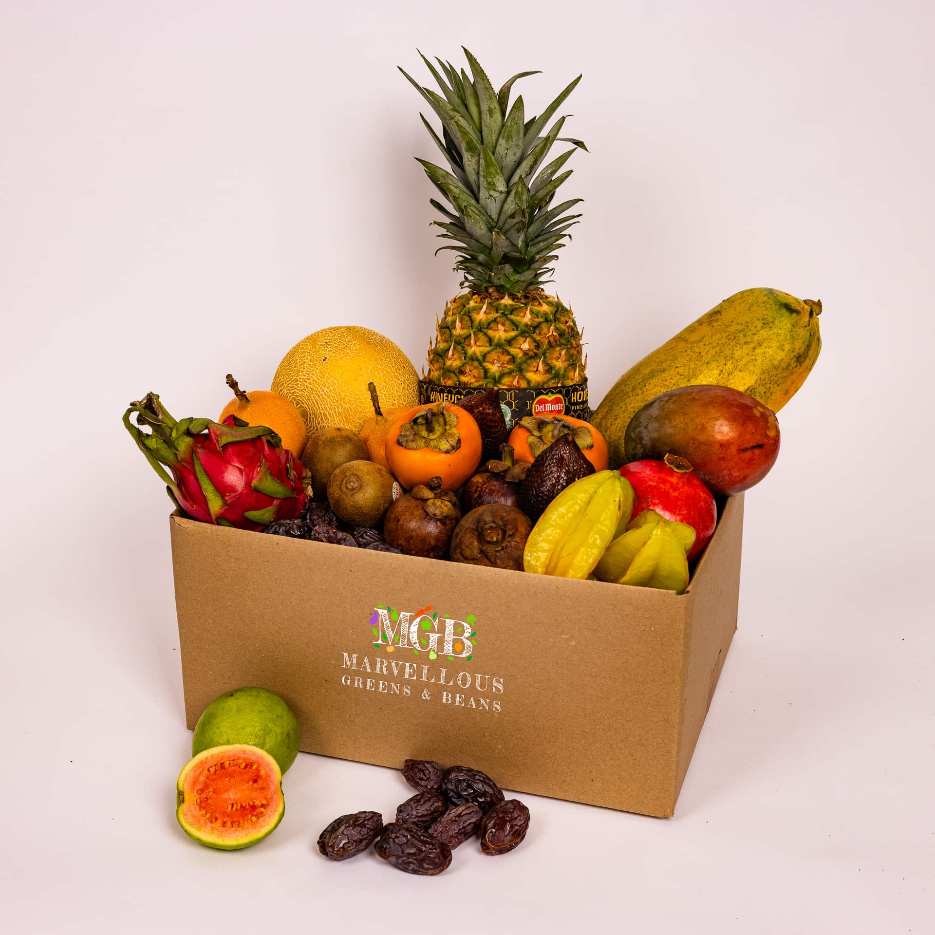 Exotic fruit box with mangoes and tropical fruits